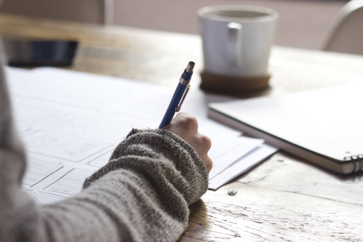 Student planning a focused NEET repeater year with notes and timetable